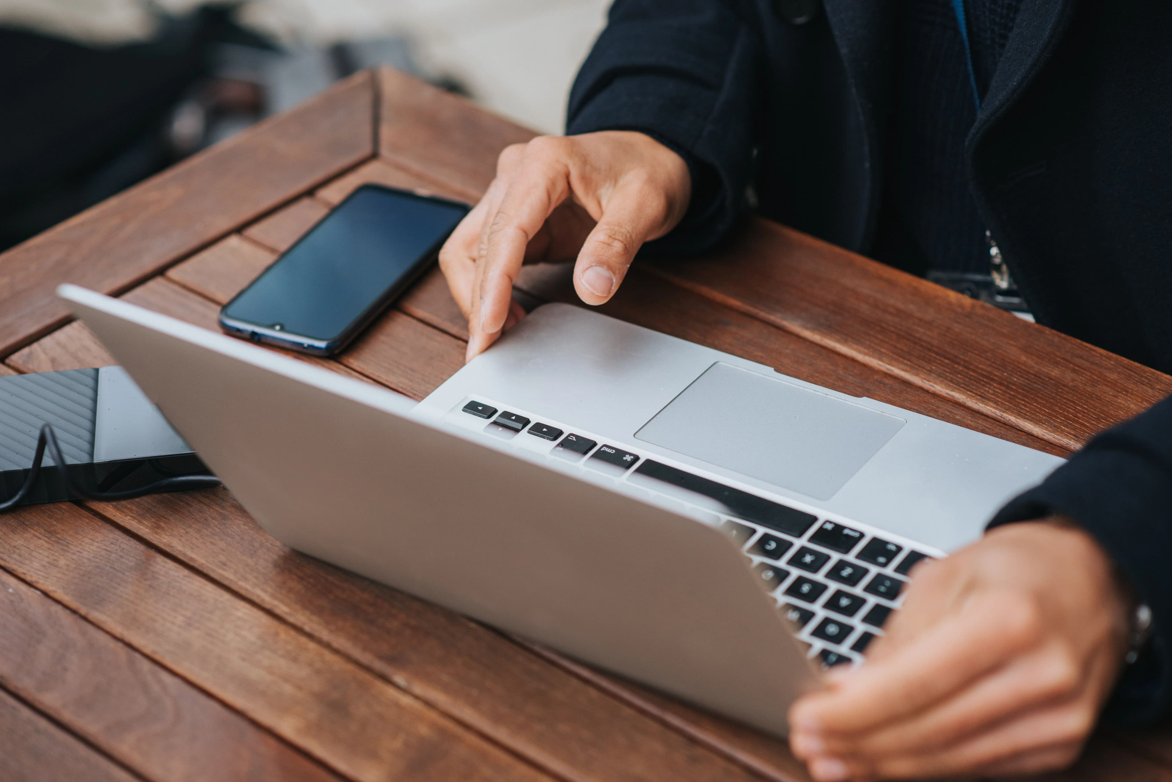 Working through a build - laptop open, hands on the work